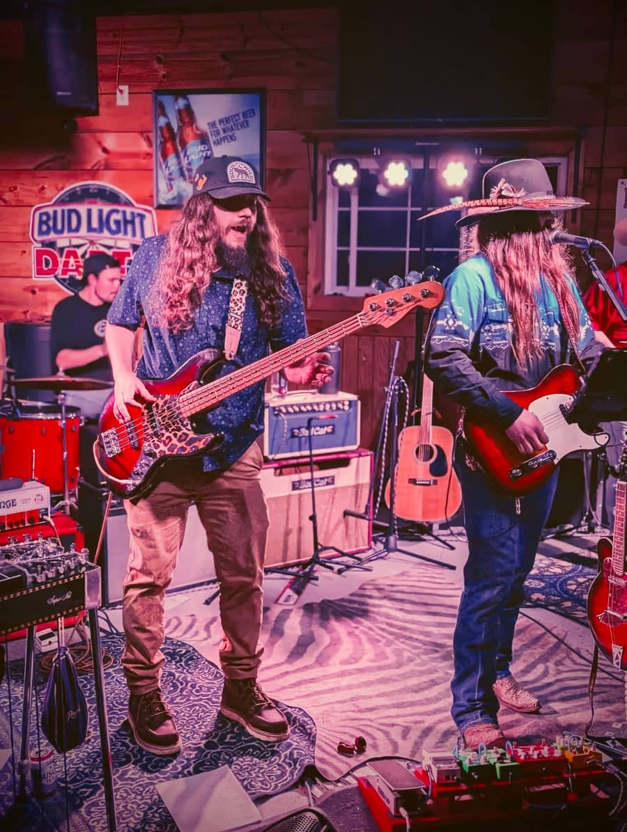 Bryor Rhodes and the bass player mid-song at a packed bar show