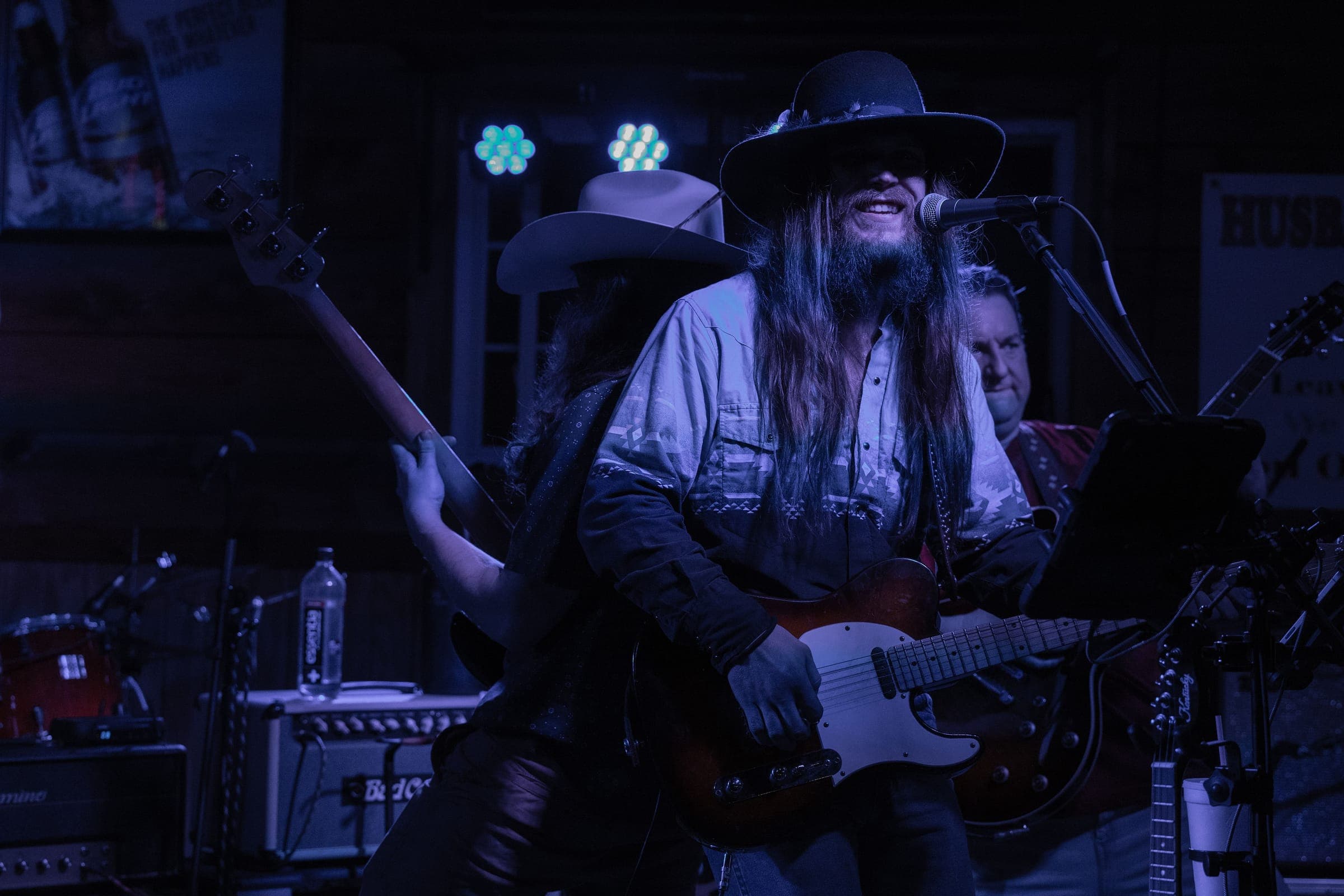 Black and white shot of the band in cowboy hats