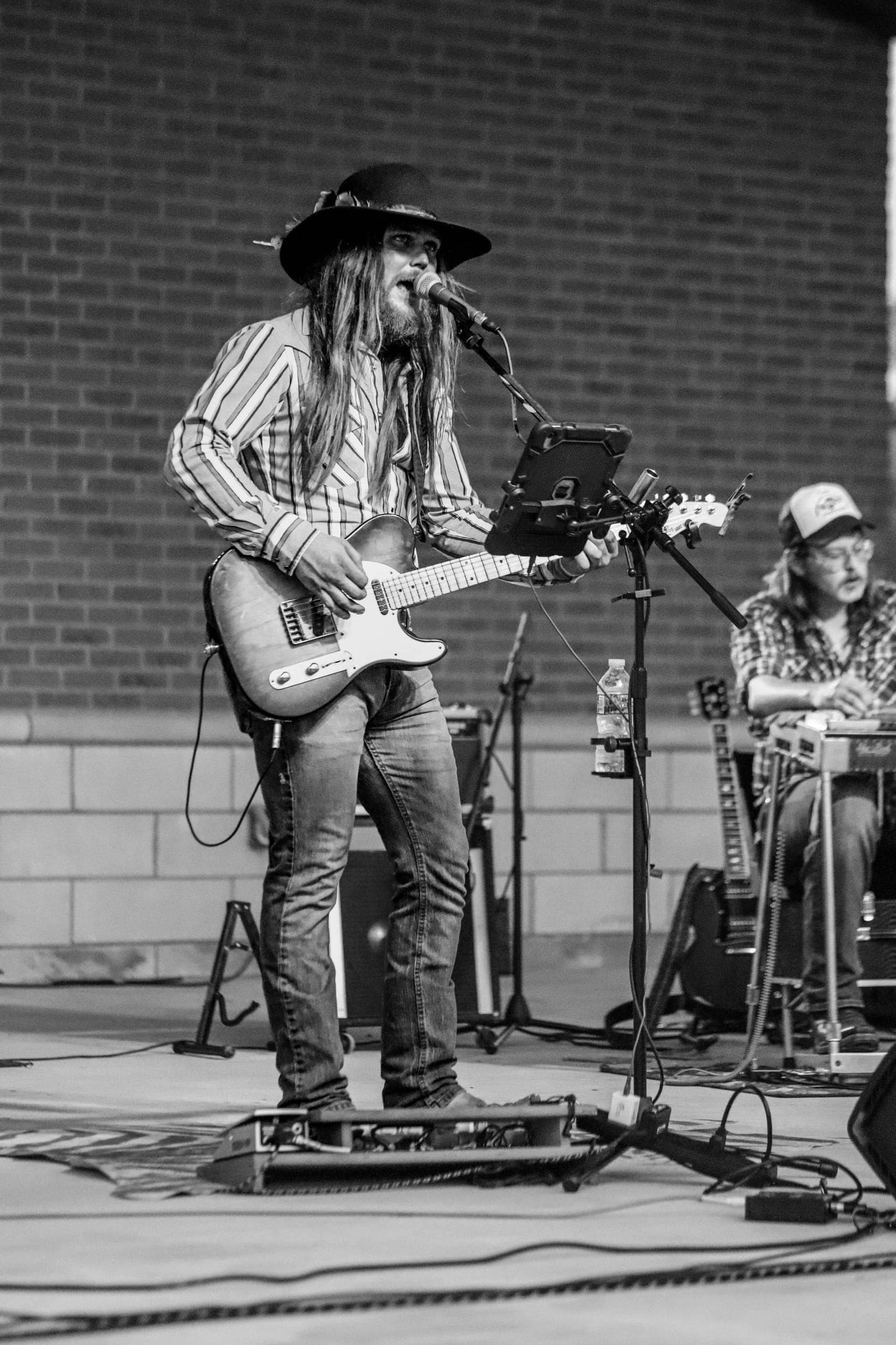 Guitarist playing a telecaster in front of the crowd