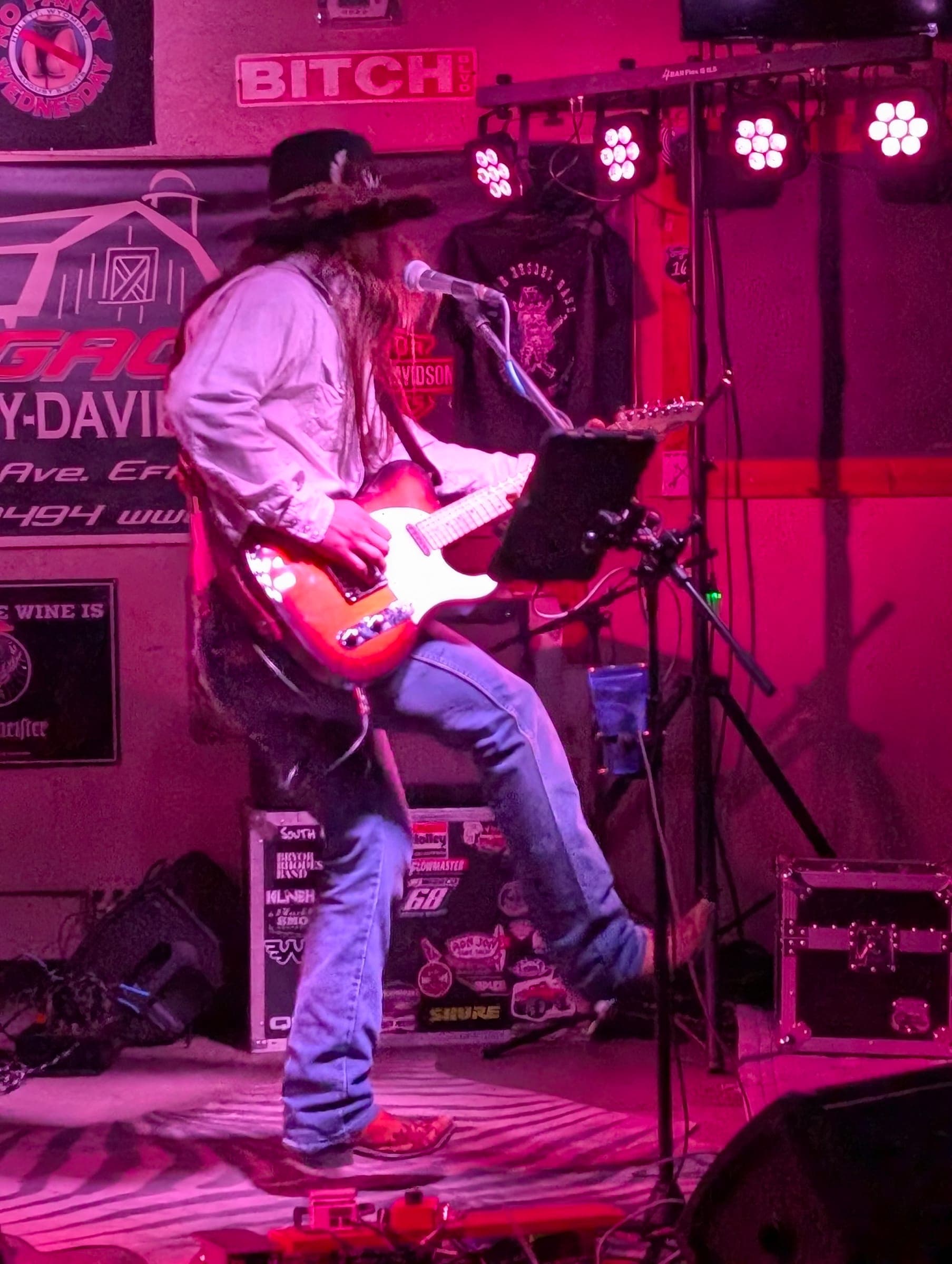 Band under pink and red stage lights